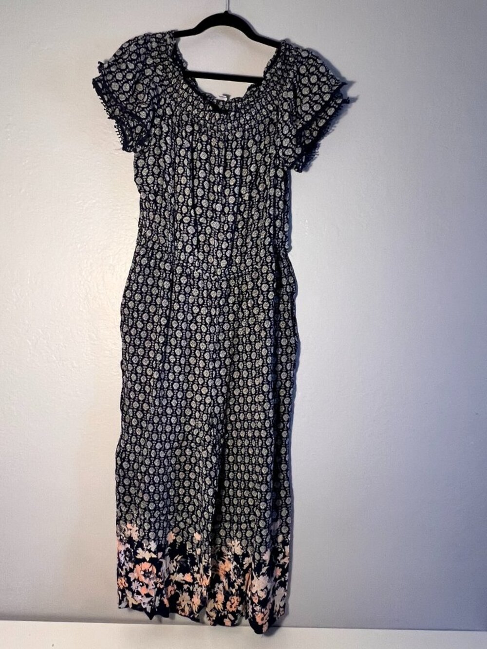 XL - Navy blue maxi jumpsuit with white floral pattern and ruffled sleeves